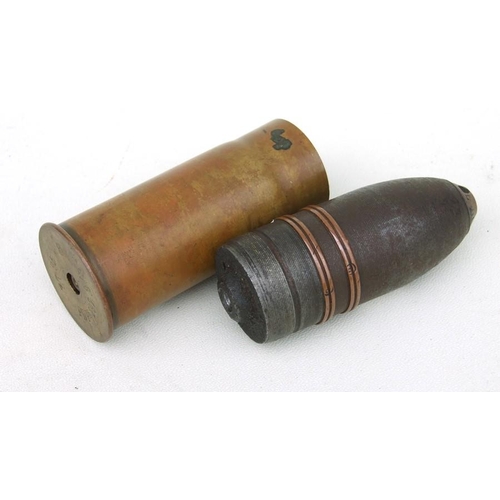 96 - A complete inert WW1 artillery shell and brass casing in two parts. Date stamp to the base for 9. 16... 