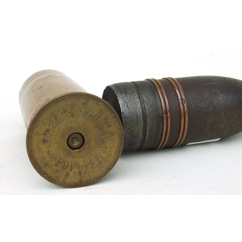 96 - A complete inert WW1 artillery shell and brass casing in two parts. Date stamp to the base for 9. 16... 