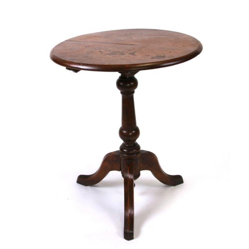 1020 - A 19th century elm tripod table, 62cms diameter.