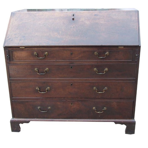 1040 - A Georgian mahogany bureau, the fall-front enclosing a fitted interior above four graduated long dra... 