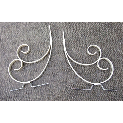 11 - A pair of painted wrought iron shelf brackets.