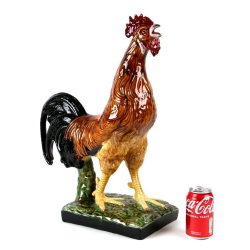 118 - A large Bordallo Pinheiro Portuguese majolica figure of a cockerel. 54cm high