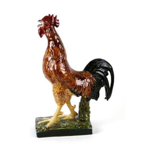 118 - A large Bordallo Pinheiro Portuguese majolica figure of a cockerel. 54cm high