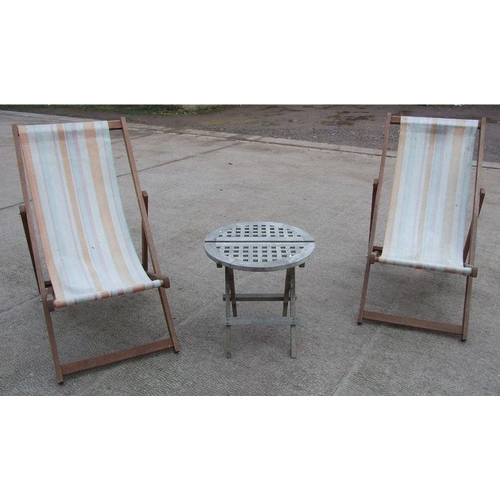 12 - A painted metal folding garden table, 100cms wide; together with two deck chairs; a folding teak occ... 