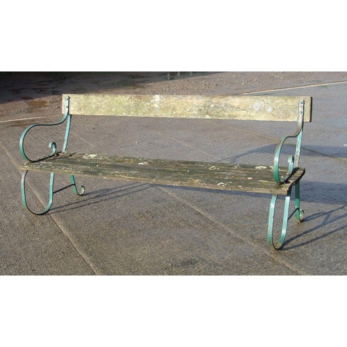 13 - A wrought iron and slatted wood garden bench, 184cms wide.