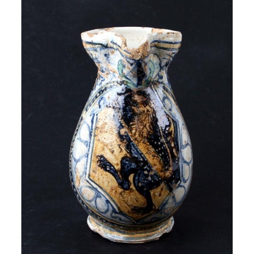 138 - A Montelupo style armorial jug, the ovoid body painted with an octagonal panel enclosing a rampant l... 