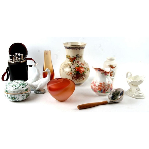 156 - A mixed lot of ceramics and glassware to include Nao geese, Art glass vases, leather cased spirit fl... 