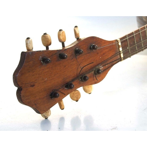 171 - An Italian rosewood mandolin, bears paper label - Il Globo - 60cms long