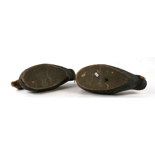 227 - A pair of papier-mâché 'Carry-lite' decoy ducks, 38cms long (2).Condition Report Both missing the ti... 