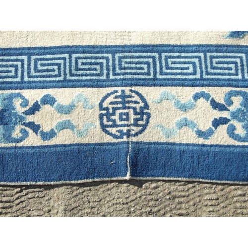 234 - A Chinese blue & white carpet. 280 by 187cm