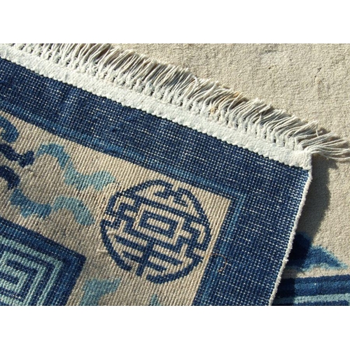 234 - A Chinese blue & white carpet. 280 by 187cm