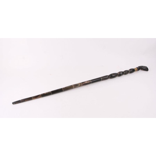 415 - An Egyptian sectional horn walking stick, 94cms long.