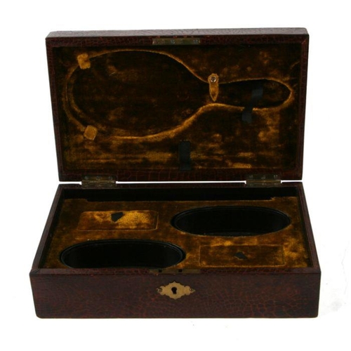 459 - An early 20th century faux crocodile skin leather vanity box with fitted interior, 28cms wide.