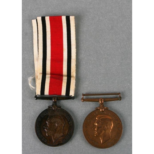 46 - A George V Special Constabulary medal awarded to Edward Dunn; together with another awarded to Frank... 