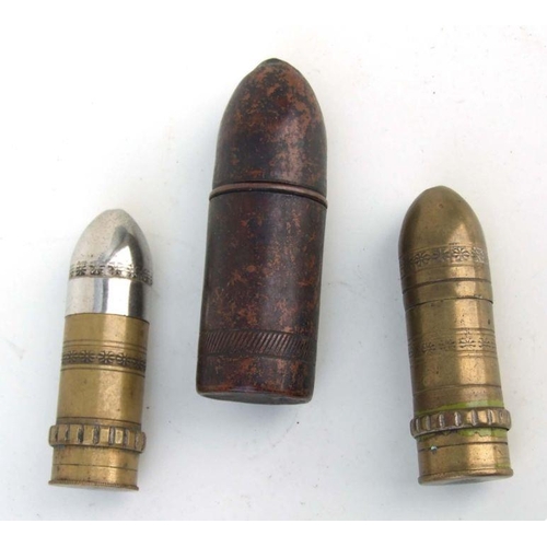 51 - Three WW1 petrol lighters shaped like artillery shells. The largest being 9cms (3.5ins) tall by 3cms... 