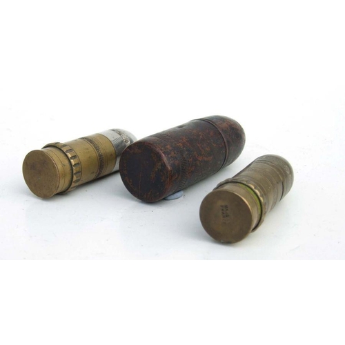 51 - Three WW1 petrol lighters shaped like artillery shells. The largest being 9cms (3.5ins) tall by 3cms... 