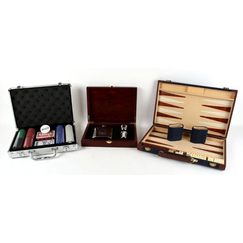 528 - A Beretta boxed silver plated hip flask set; together with a cased set of poker chips; a backgammon ... 