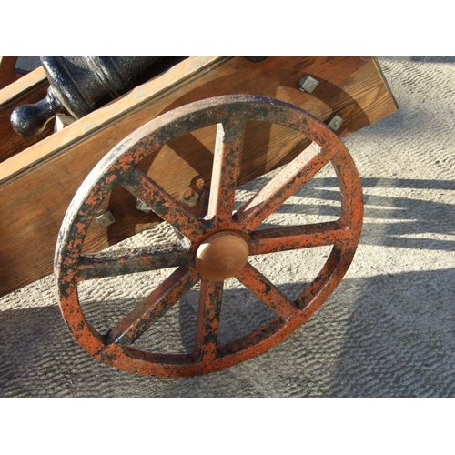 53 - A 19th century cast iron cannon mounted on a later wood and metal carriage. The barrel with GR cyphe... 