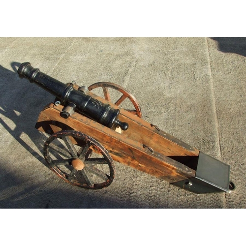 53 - A 19th century cast iron cannon mounted on a later wood and metal carriage. The barrel with GR cyphe... 