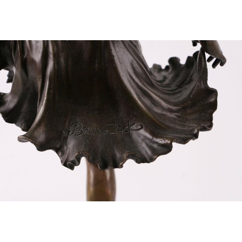 533 - After Bruno Zach - a modern bronze figure of a dancer, with foundry mark, on a marble plinth, 54cms ... 