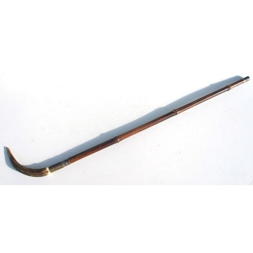 54 - A cane sword stick with 64.5cms (25.375ins) triangular steel blade and stag horn handle