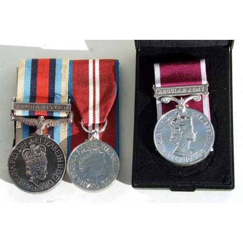 59 - A court mounted Welsh Regiment Operational Service Medal with Afghanistan clasp named to '25159743 L... 