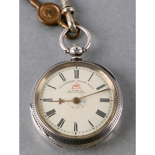 595 - A silver cased open faced fob watch on an Albert chain.