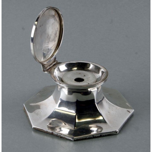 617 - An early 20th century silver Capstan inkwell of flared octagonal form, marks rubbed, 12cms wide.