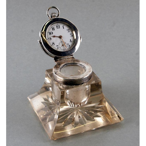 618 - An Edwardian novelty silver and glass inkwell, the lid inset with a pocket watch with subsidiary sec... 