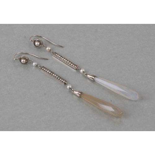 664 - A pair of 18ct white gold drop earrings with seed pearl set suspension bar and elongated faceted aga... 