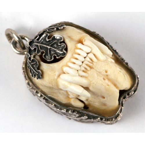 672 - A Charivari  - Bavarian hunting jewellery pendant, a full set of large polecat jaws set in a silver ... 