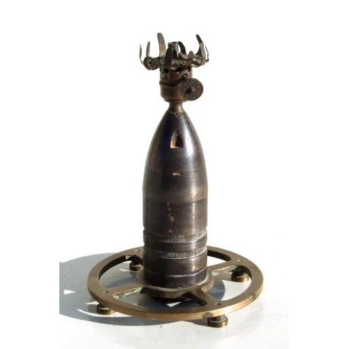 70 - An unusual trench art oil lamp made from an inert WW1 artillery shell. Overall height 15cms (6ins)