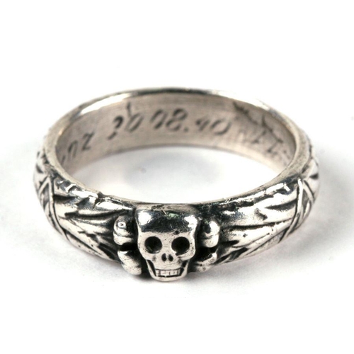 72 - A WWII German SS Officer's death head style silver ring with Swastika runic insignia of the Schutzst... 