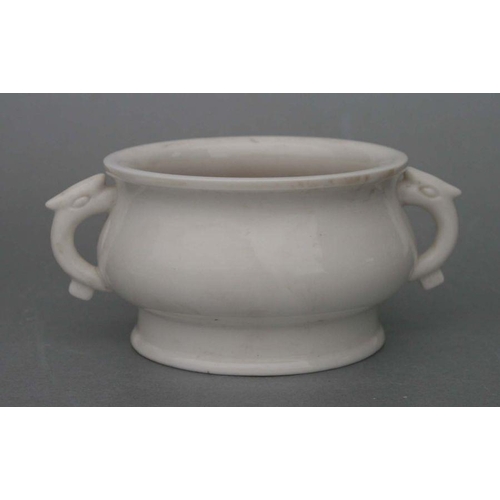 731 - A Chinese pottery two-handled censer with impressed seal mark to the underside, 13cms diameter.