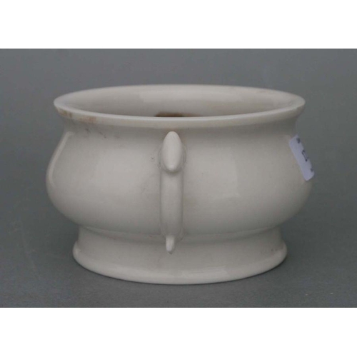 731 - A Chinese pottery two-handled censer with impressed seal mark to the underside, 13cms diameter.