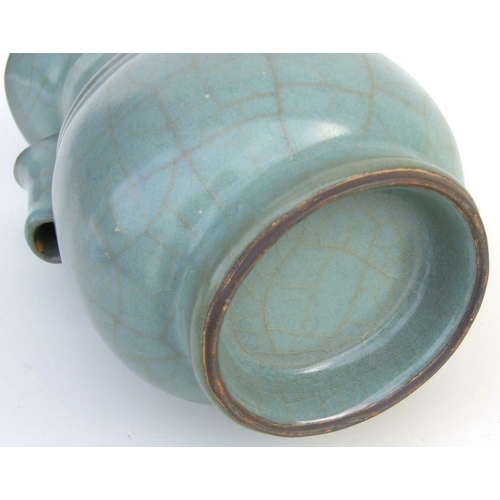 783 - A Chinese celadon crackle glaze two-handled vase, 21.5cms high.