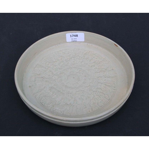 787 - A Chinese celadon glaze shallow dish or brush washer decorated with figures in a procession, 22cms d... 