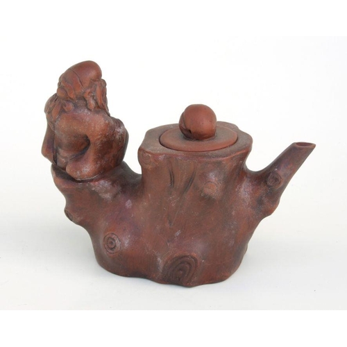 800 - A Chinese Yixing pottery teapot with figural handle and peach finial, impressed seal mark to the und... 