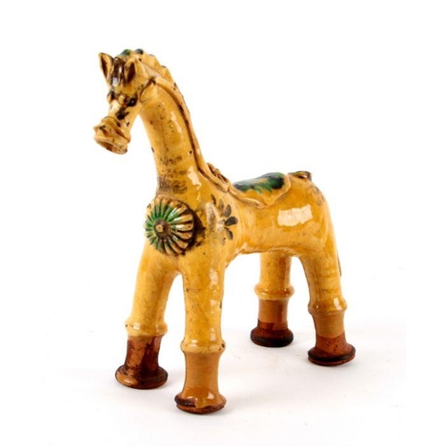 805 - A Turkish Canakkale pottery figure of a stylised horse, 24cms high.