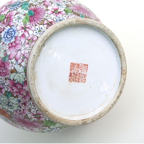 839 - A Chinese millefiori bottle vase with red seal mark to the underside, 33cms high.