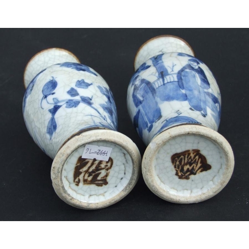 843 - A pair of Chinese blue & white crackle ware vases decorated with flowers, incised mark to the unders... 