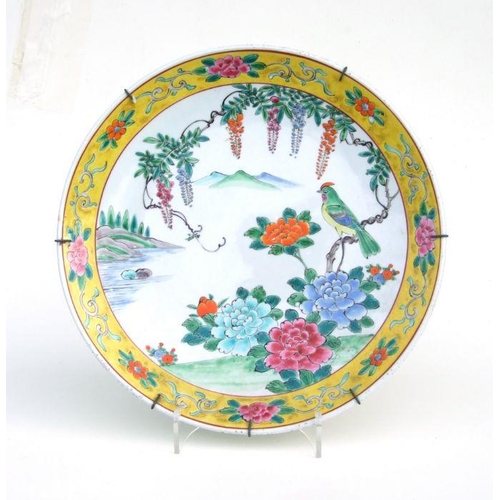 846 - A Chinese famille vert charger decorated with a scrolling dragon, 42cms diameter; together with a Ch... 