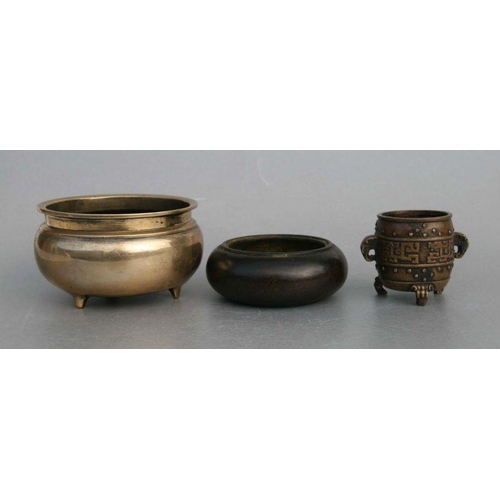 848 - A Chinese polished bronze / brass tripod censer, 12cms diameter; together with a Chinese bronze cens... 