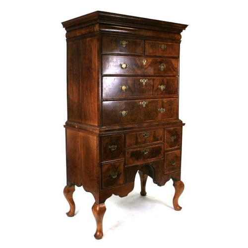 876 - A George II walnut chest-on-stand with later adaptions, the top with an arrangement of two short and... 