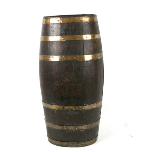 897 - A brass bound oak rum barrel used as a stick stand, 70cms high.