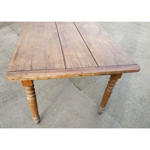 898 - A continental fruitwood farmhouse table with three plank top, single frieze drawer and turned legs, ... 