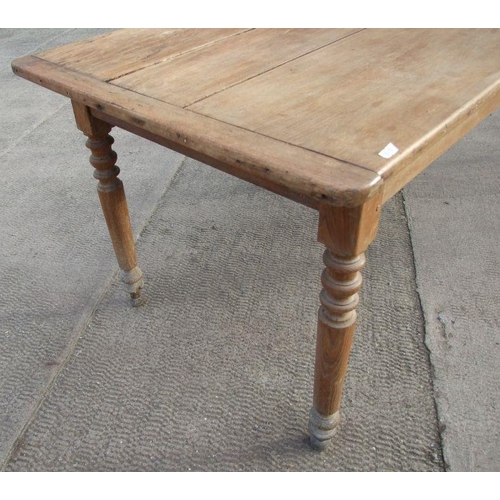 898 - A continental fruitwood farmhouse table with three plank top, single frieze drawer and turned legs, ... 