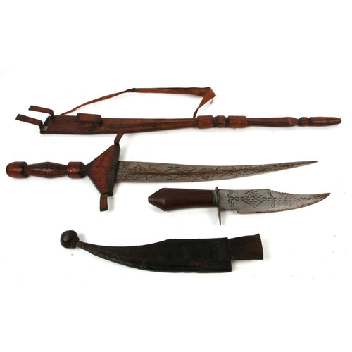 91 - A North African sword in tooled leather scabbard with multiple hidden blades, 10cms long; together w... 