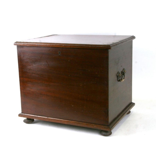 943 - A mahogany box with brass carrying handles and sectioned interior, 45cms wide.