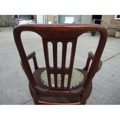 952 - A pair of 19th century mahogany elbow chairs with upholstered seatsCondition ReportOne chair has had... 